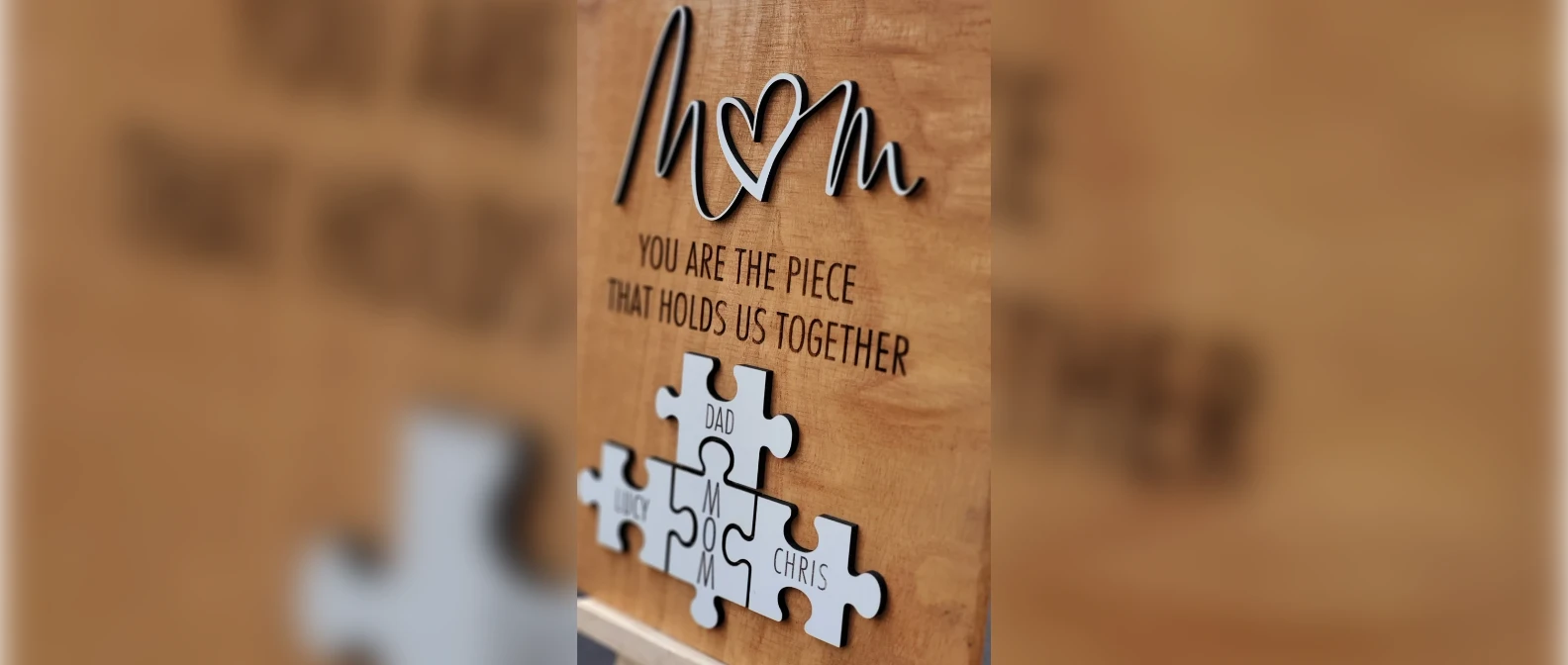 Wooden puzzle sign with a family name on each piece, a gift for grandma from the grandkids