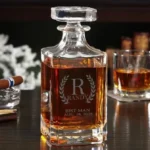 Personalized engraved whiskey decanter with a monogram, on a dark bar